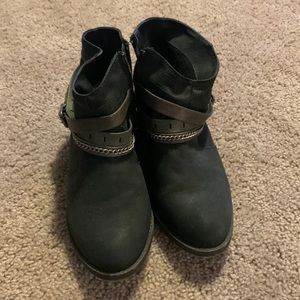 Black ankle boots with cross chains